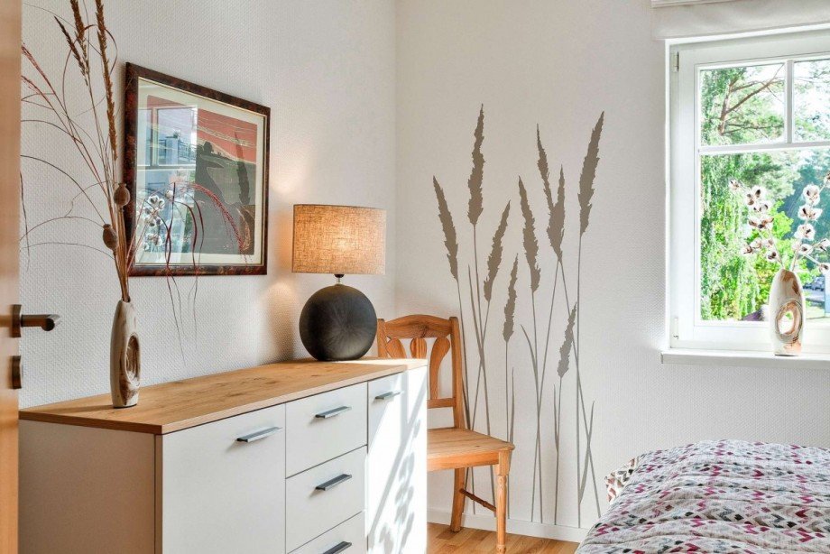 Schlafzimmer mit liebevollen Einrichtungsdetails Haus Rheinsberg