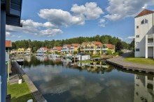 Blick aus dem Balkon Mit direktem Wasserzugang, privatem Bootsanleger und Insel-Lage: Ferienhaus im Hafendorf Rheinsberg