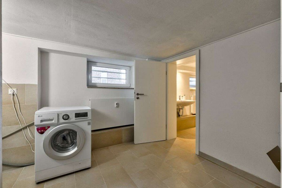 Gemeinschaftsraum im Kellergeschoss mit Waschmaschinenanschluss Mehrfamilienhaus Wunstorf